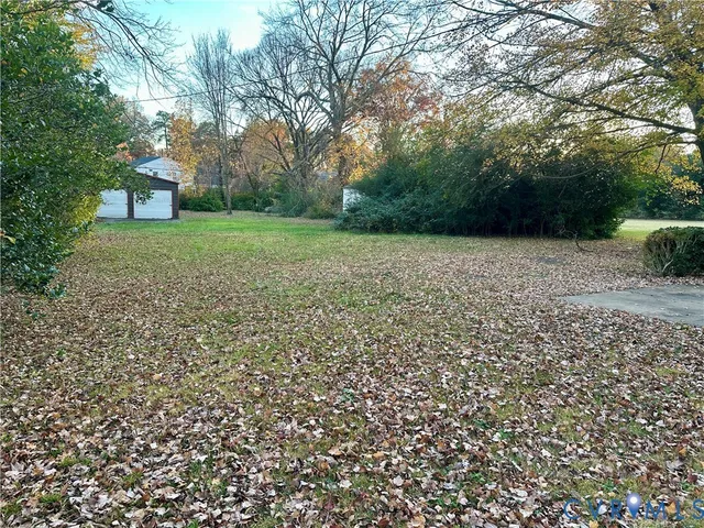 a view of a yard with a trees