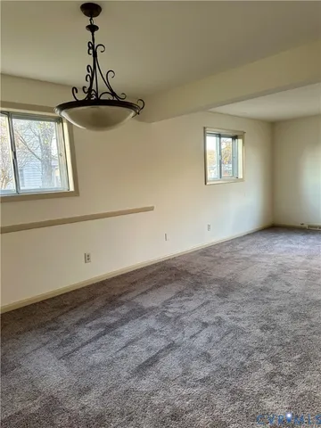 a view of empty room with windows