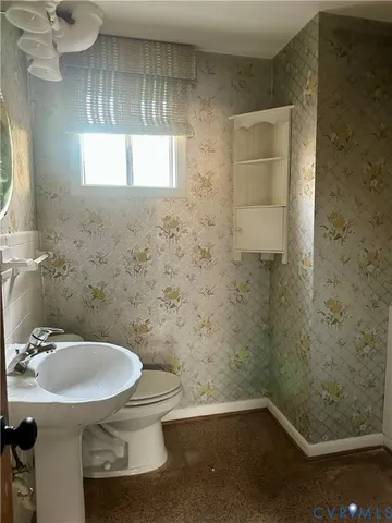 a bathroom with a sink and a toilet