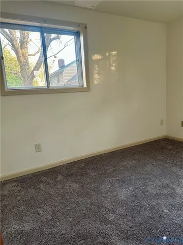 an empty room with a empty space and window