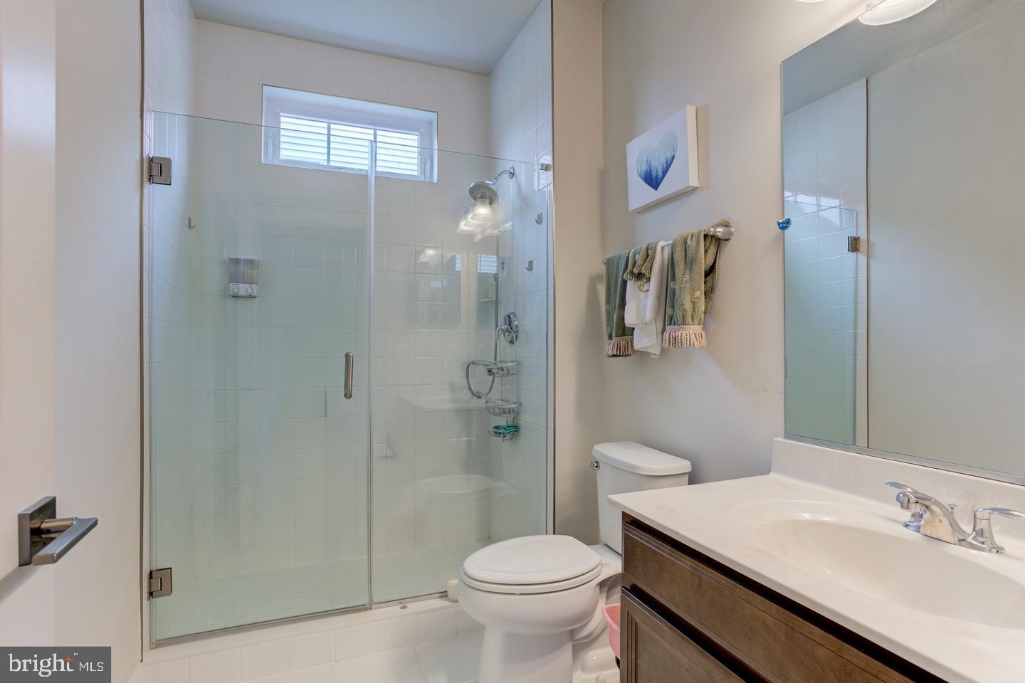 4902 Bridle Ridge Road Upper Marlboro, MD 20772 - Photo 12 of 20 a bathroom with a sink toilet and shower
