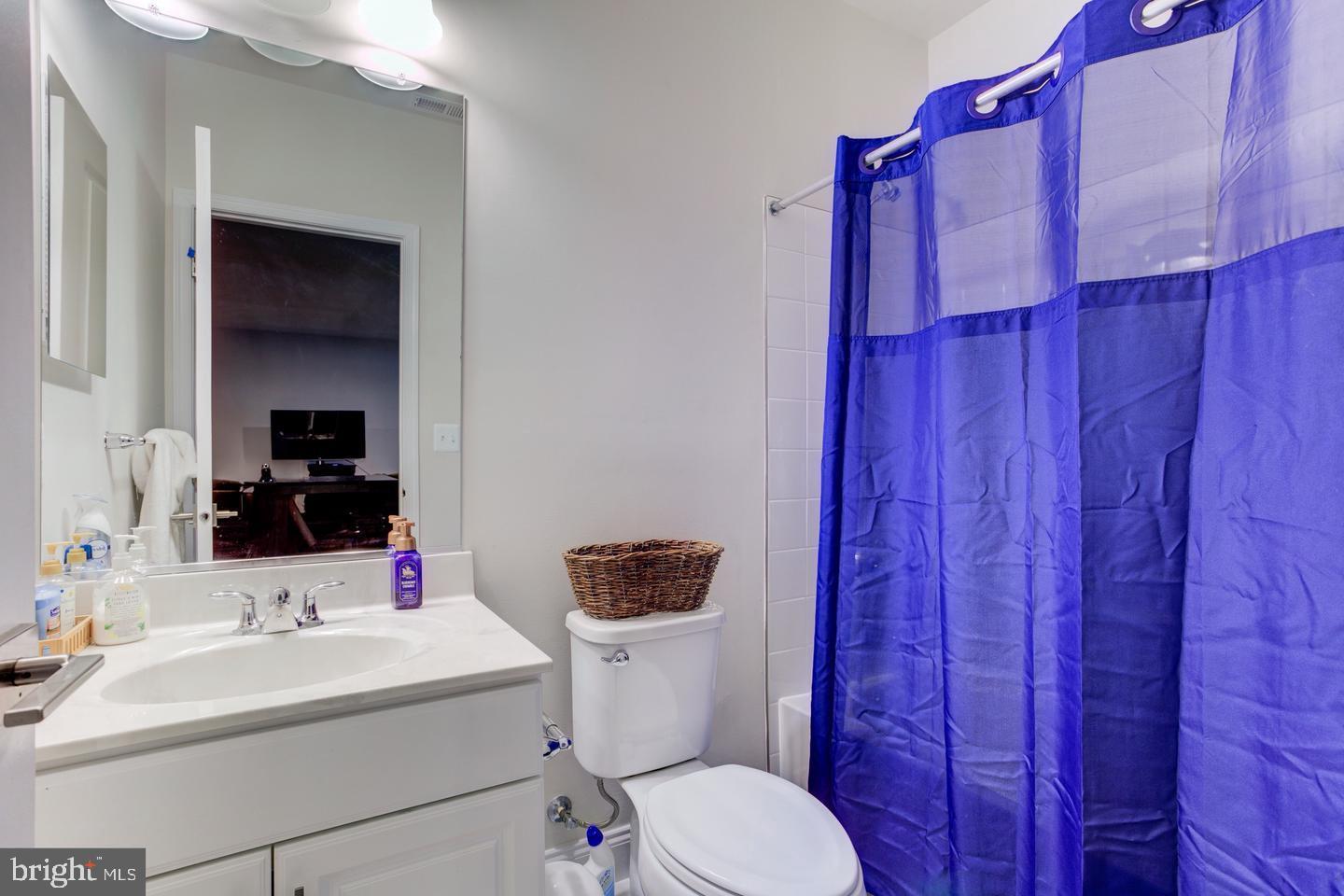 4902 Bridle Ridge Road Upper Marlboro, MD 20772 - Photo 16 of 20 a bathroom with a sink mirror vanity and toilet