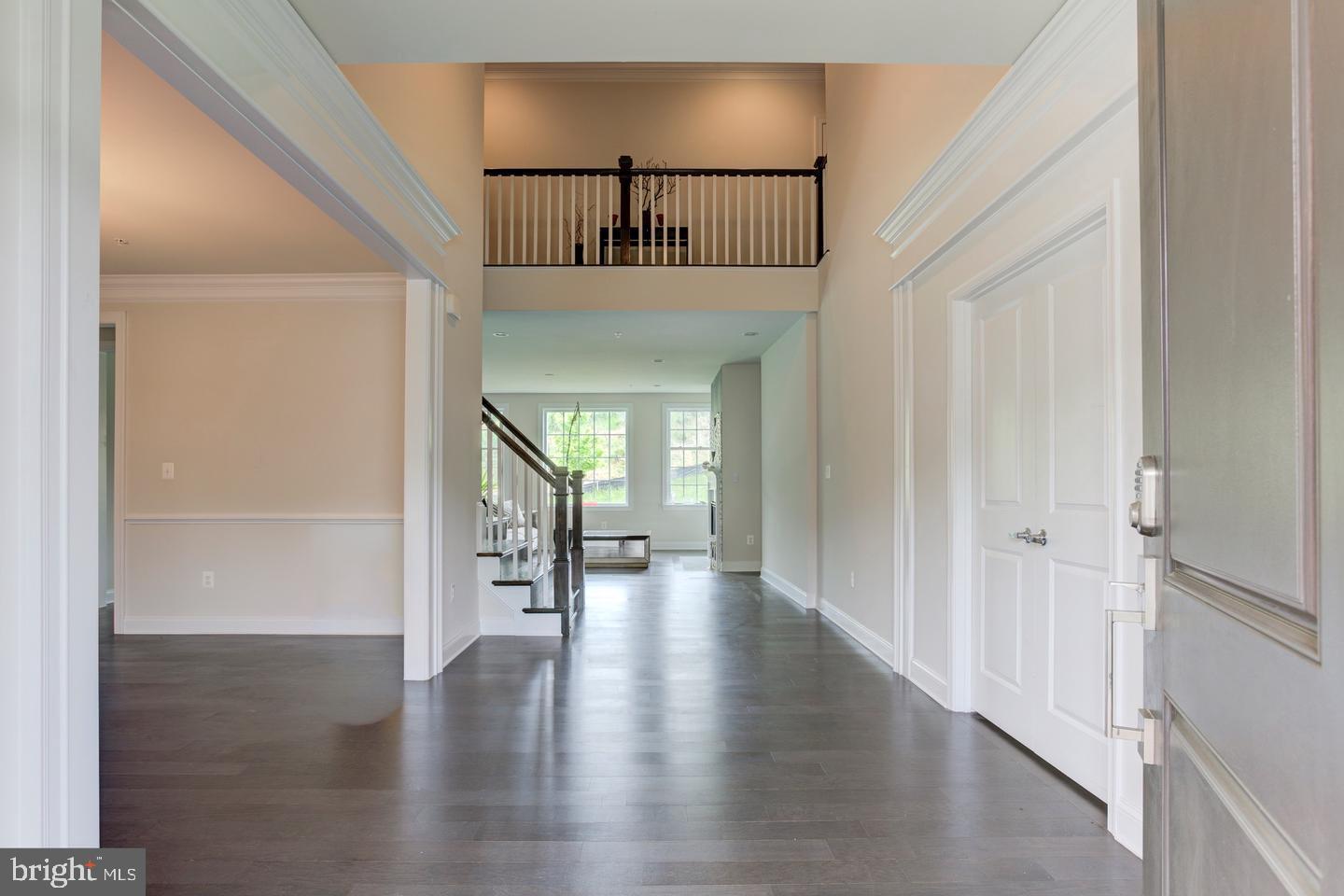4902 Bridle Ridge Road Upper Marlboro, MD 20772 - Photo 2 of 20 a hallway with wooden floor chandelier and entryway