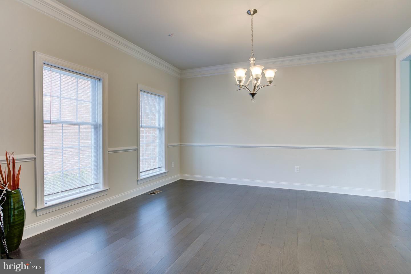 4902 Bridle Ridge Road Upper Marlboro, MD 20772 - Photo 3 of 20 wooden floor in an empty room with a window