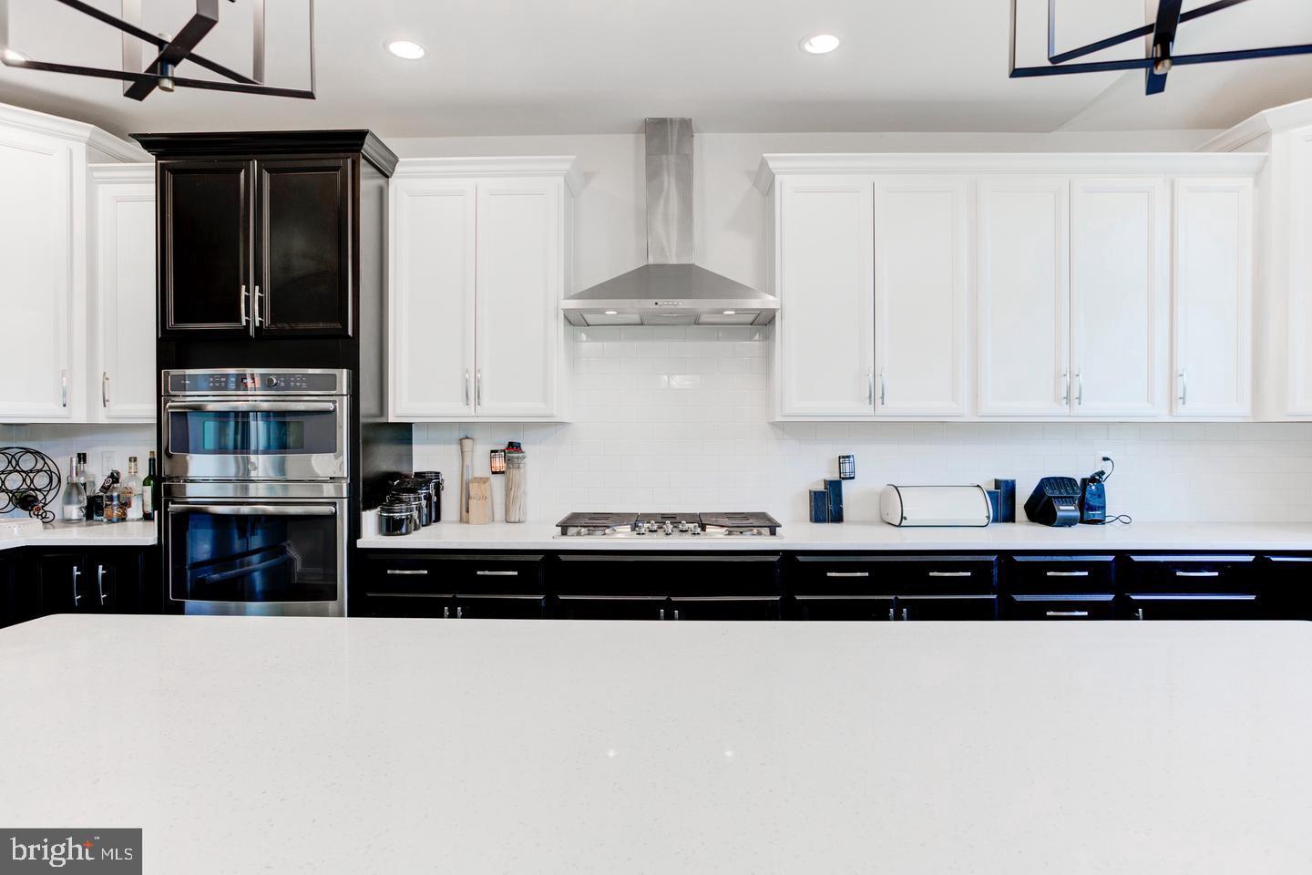 4902 Bridle Ridge Road Upper Marlboro, MD 20772 - Photo 7 of 20 a kitchen with stainless steel appliances a sink a stove and cabinets