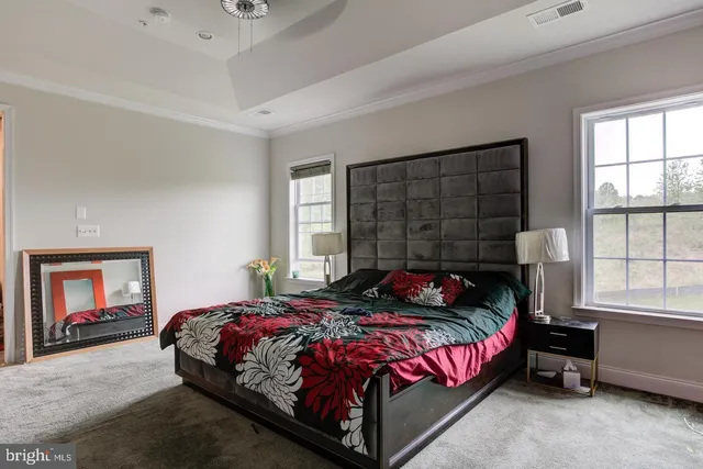 a bedroom with a bed and window