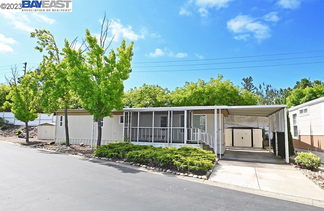 3263 Vineyard, Unit 83 Pleasanton, CA 94566 - Photo 1 of 1 a front view of a house having yard