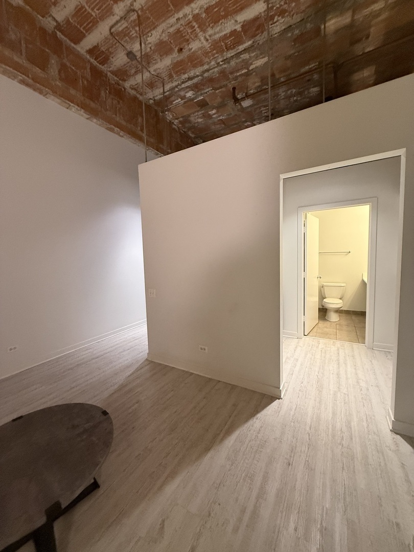 222 South Racine Avenue, Unit 207 Chicago, IL 60607 - Photo 12 of 29 a view of a livingroom with wooden floor