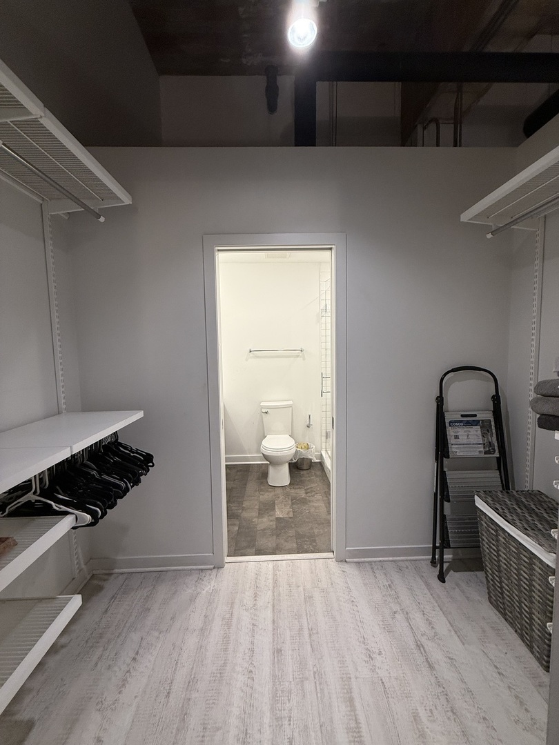 222 South Racine Avenue, Unit 207 Chicago, IL 60607 - Photo 23 of 29 a view of empty room with wooden floor