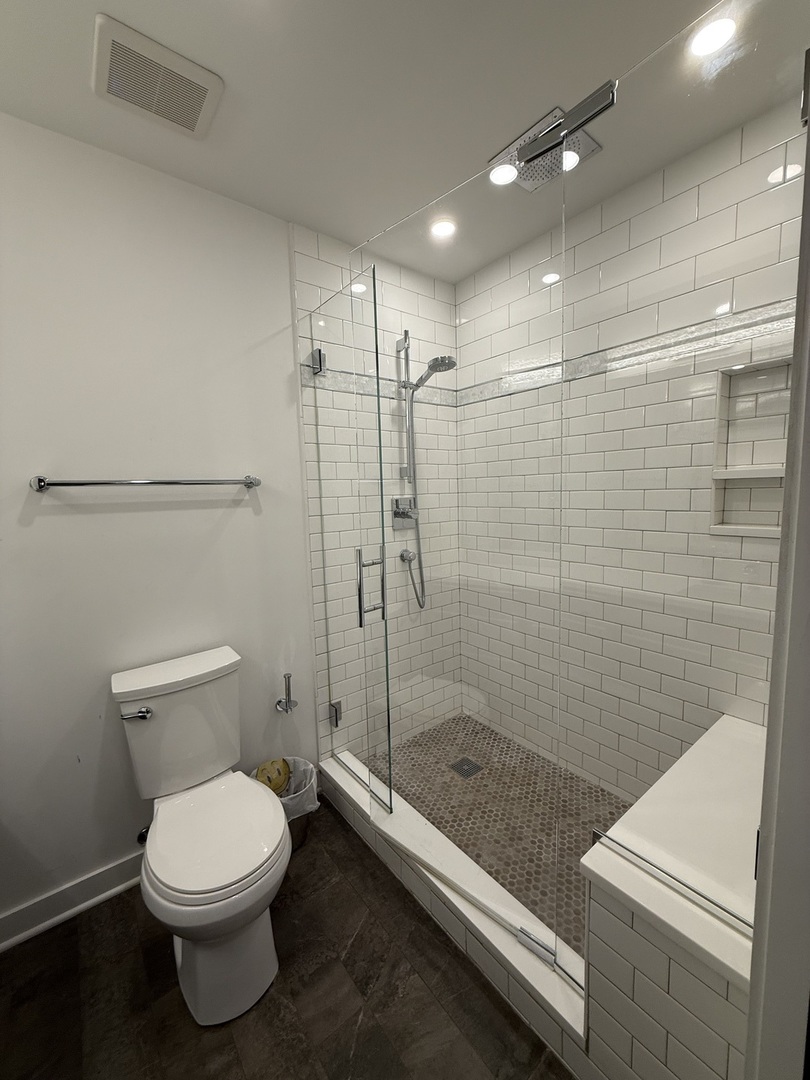 222 South Racine Avenue, Unit 207 Chicago, IL 60607 - Photo 24 of 29 a bathroom with a toilet and a shower