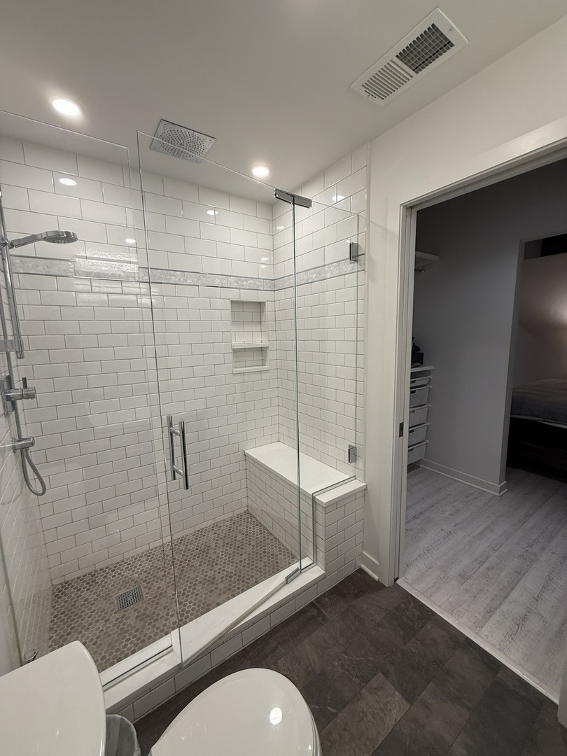 222 South Racine Avenue, Unit 207 Chicago, IL 60607 - Photo 26 of 29 a bathroom with a shower a toilet and a sink