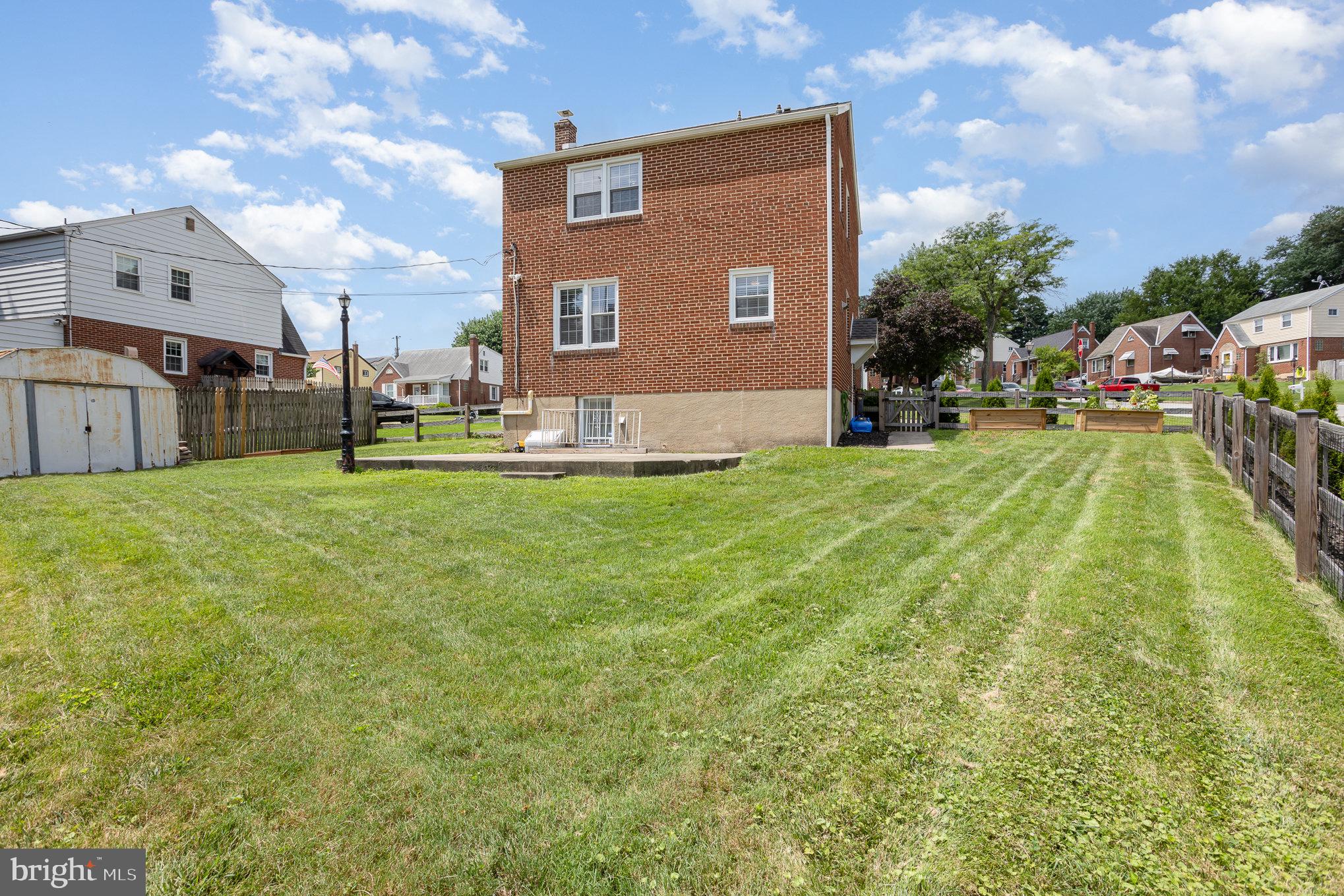 8223 Analee Avenue Rosedale, MD 21237 - Photo 33 of 37 a view of a house with a yard and sitting area