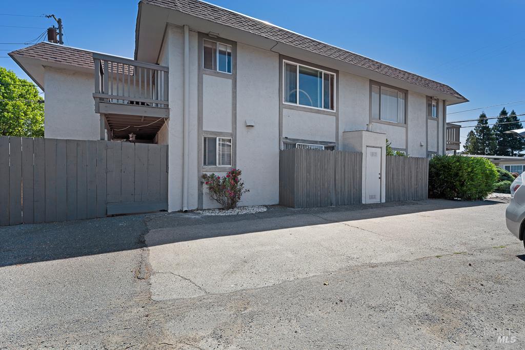 1155-1175 Evans Drive Santa Rosa, CA 95405 - Photo 6 of 31 a front view of a house with a yard and garage