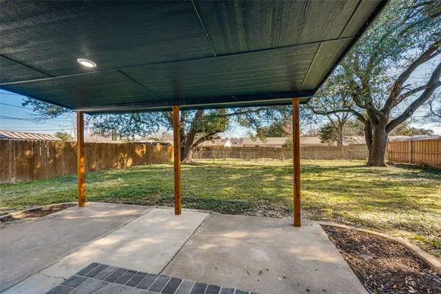 a view of backyard with green space