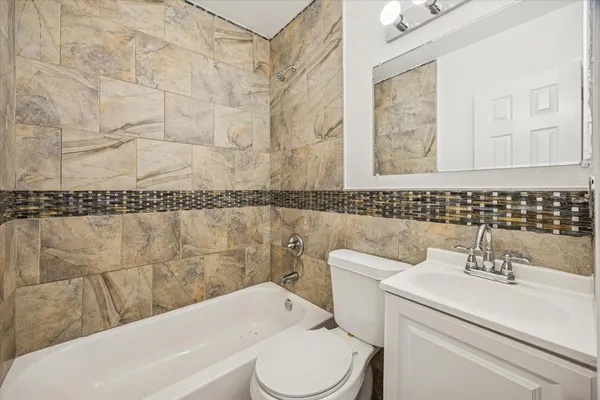 a bathroom with a sink a mirror and a toilet