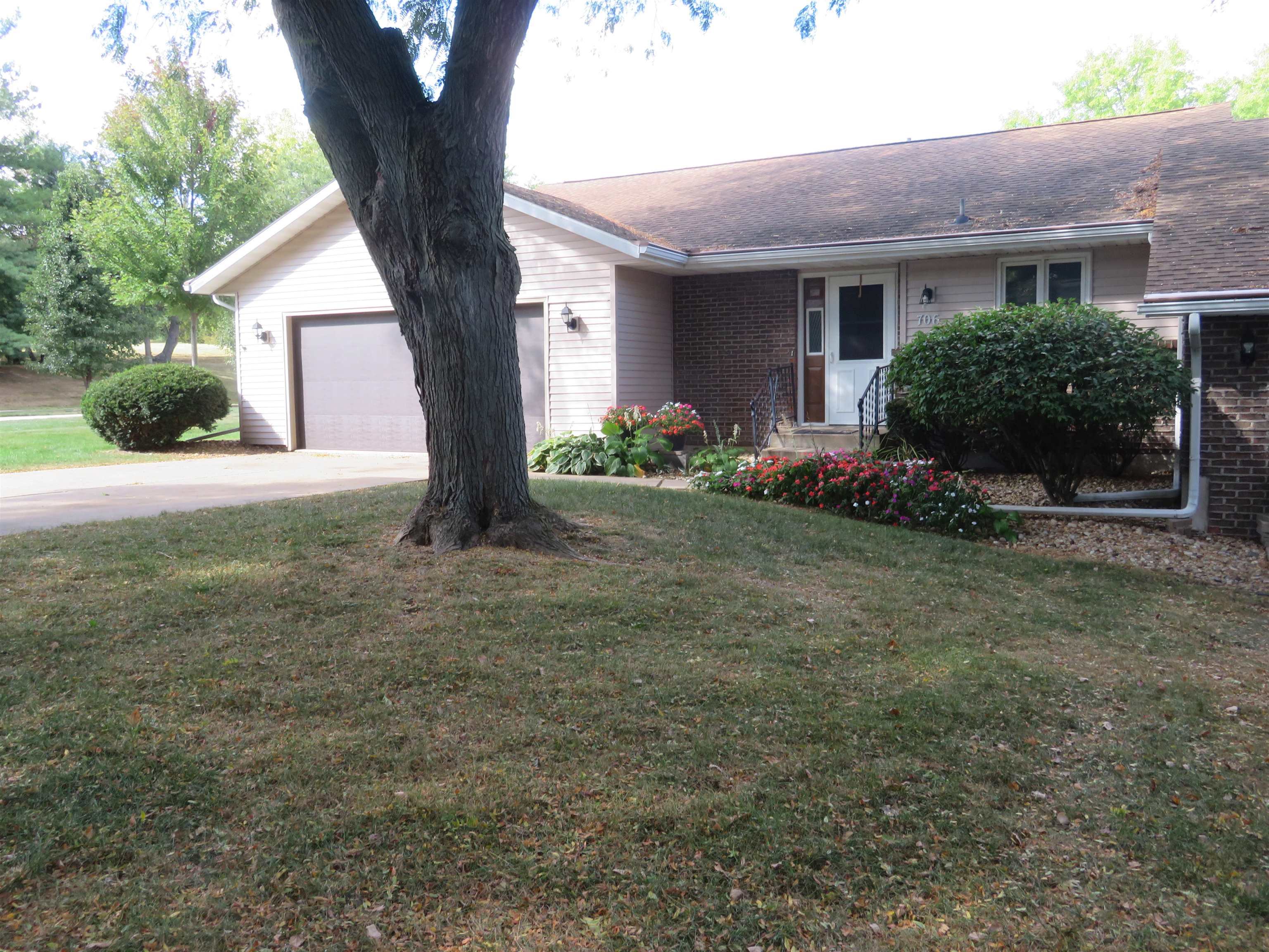 a front view of a house with garden