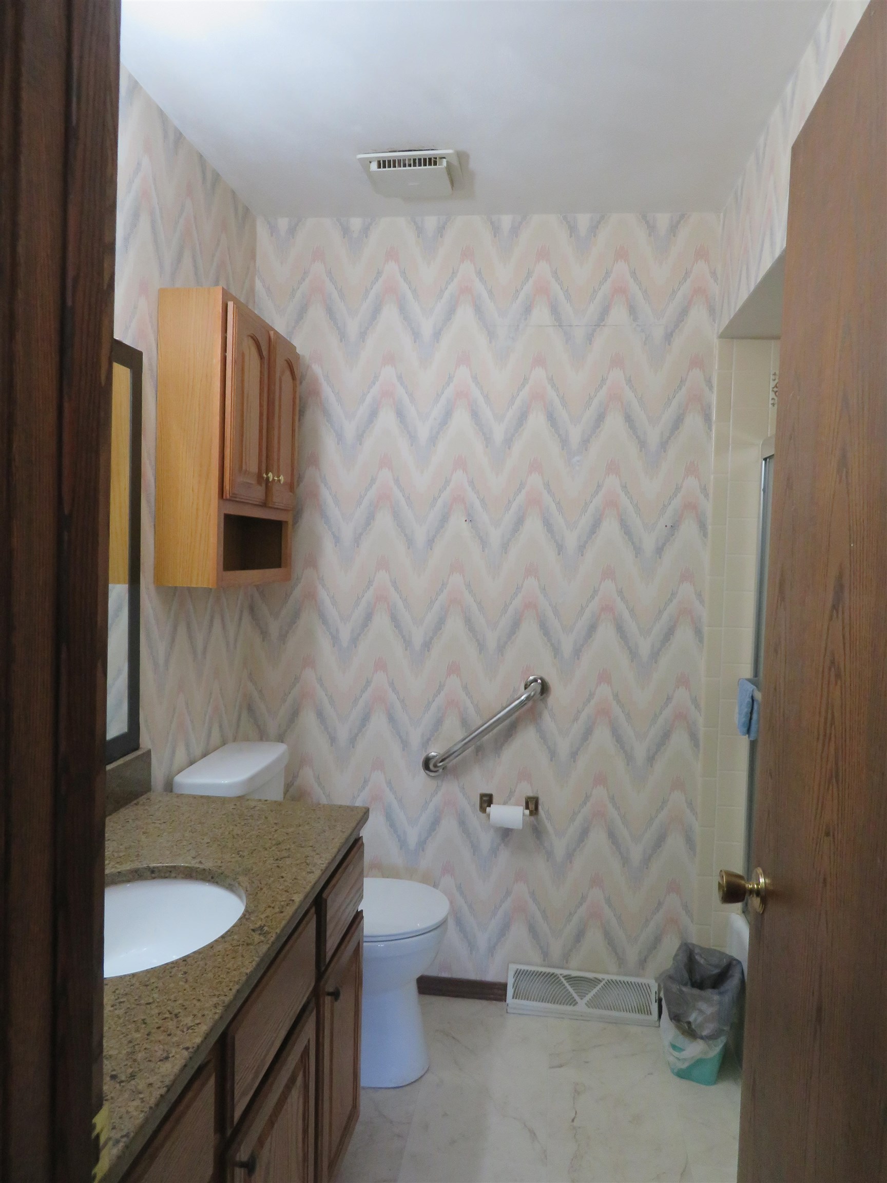 706 Quail Ridge Drive Freeport, IL 61032 - Photo 12 of 21 a bathroom with a granite countertop sink and a mirror