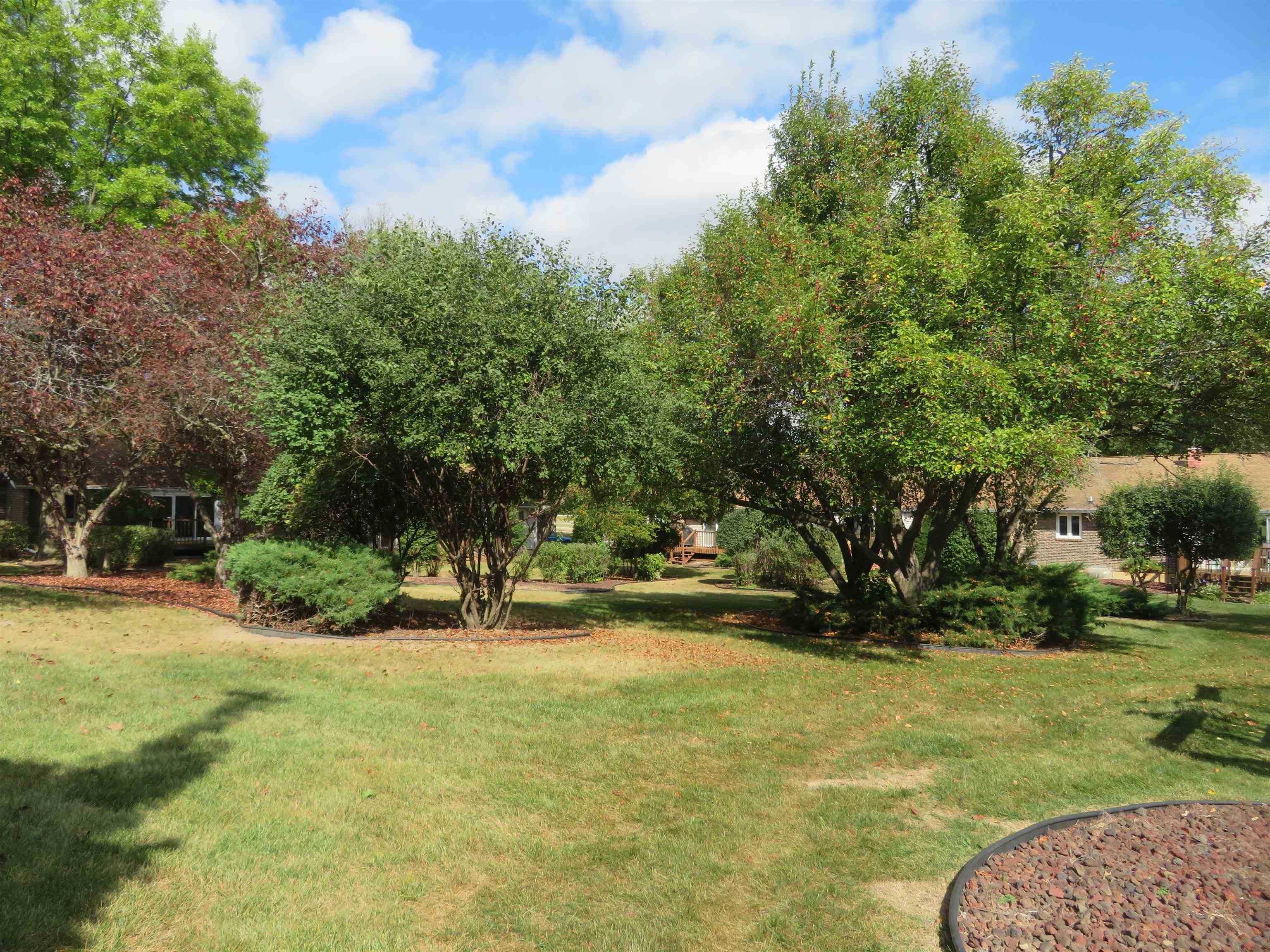 706 Quail Ridge Drive Freeport, IL 61032 - Photo 20 of 21 a view of swimming pool with outdoor seating and green space