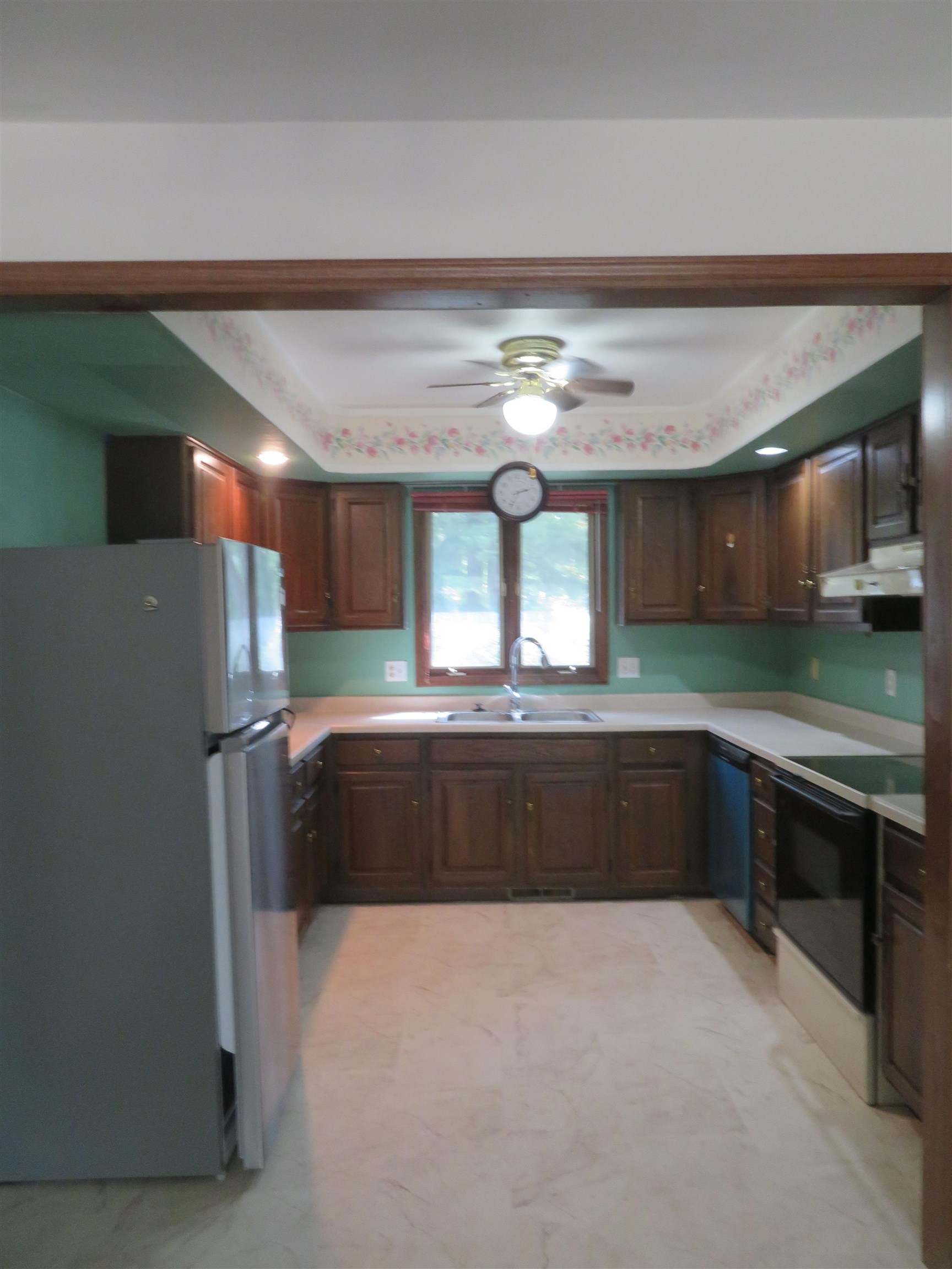 706 Quail Ridge Drive Freeport, IL 61032 - Photo 3 of 21 a kitchen with a refrigerator and a sink