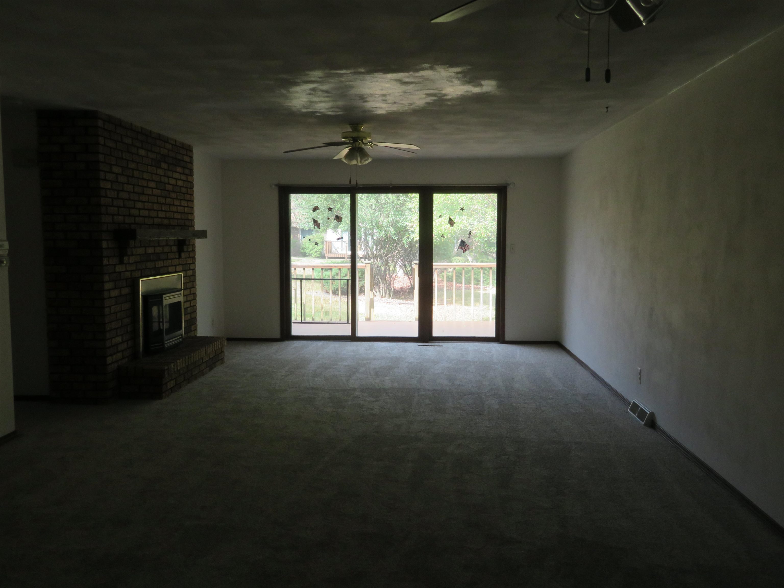 706 Quail Ridge Drive Freeport, IL 61032 - Photo 5 of 21 a view of livingroom with an empty space and a fireplace