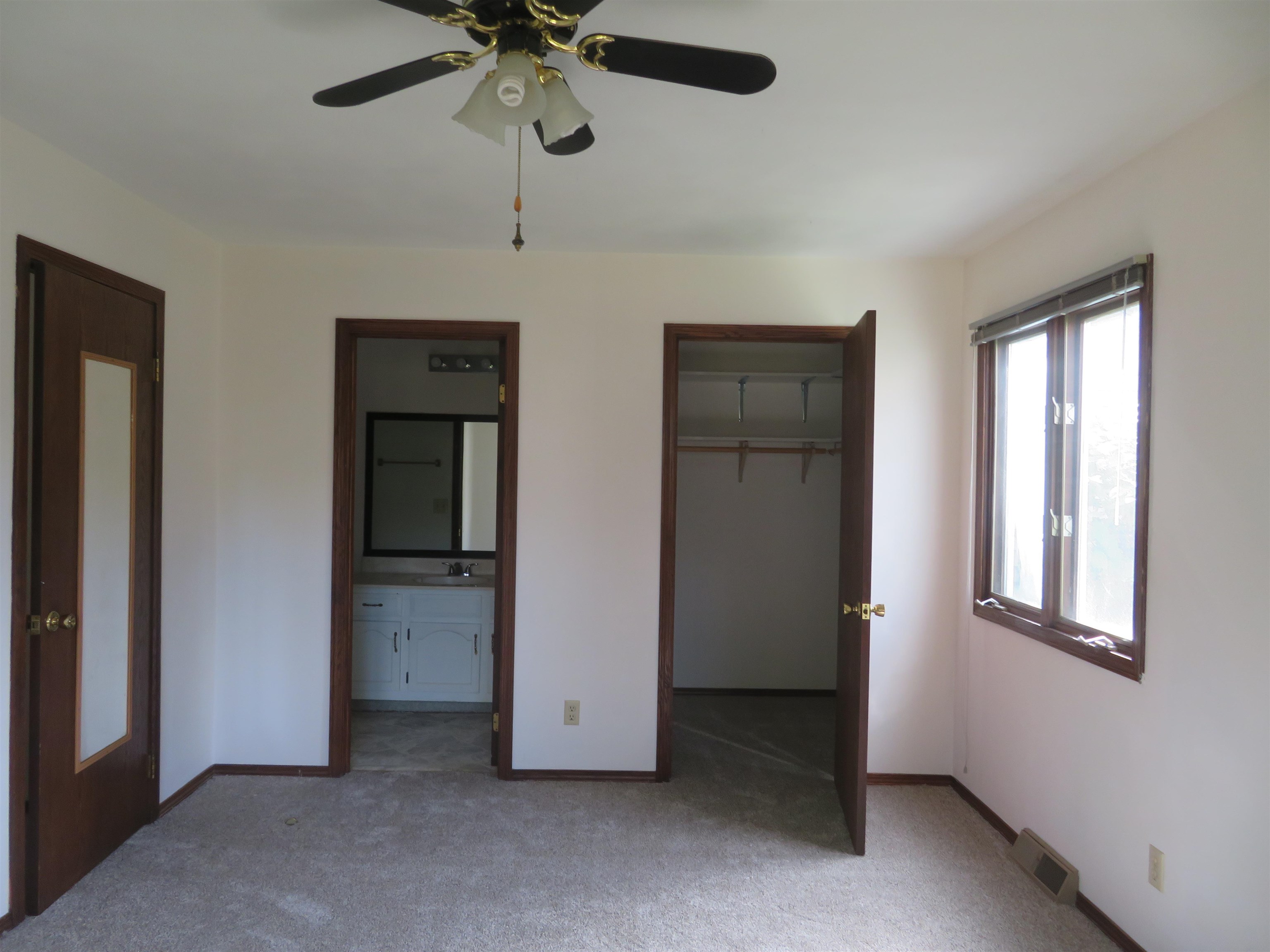 706 Quail Ridge Drive Freeport, IL 61032 - Photo 7 of 21 an empty room with windows and fan