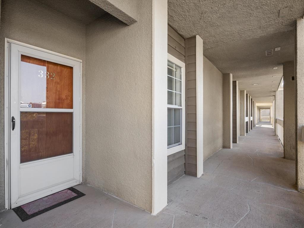 5310 Keller Springs Road, Unit 332 Dallas, TX 75248 - Photo 38 of 39 Property entrance featuring stucco siding