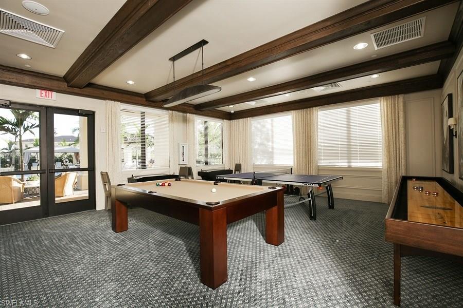 13338 Coronado Drive Naples, FL 34109 - Photo 10 of 19 a room with lots of tables a large window and chairs