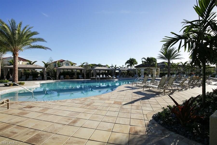 13338 Coronado Drive Naples, FL 34109 - Photo 12 of 19 a view of swimming pool with outdoor seating and plants