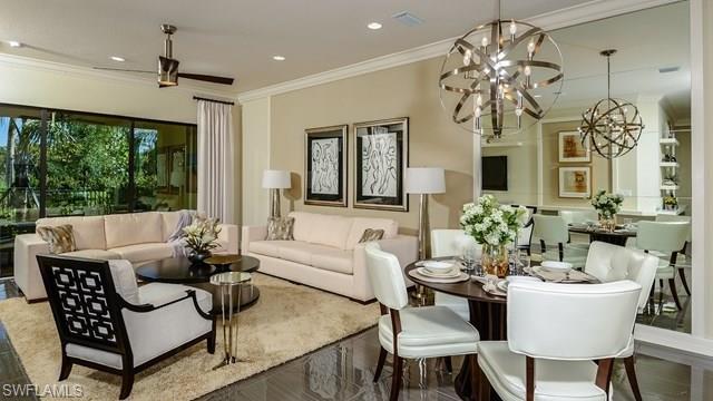 13338 Coronado Drive Naples, FL 34109 - Photo 2 of 19 a living room with furniture a chandelier and a chandelier