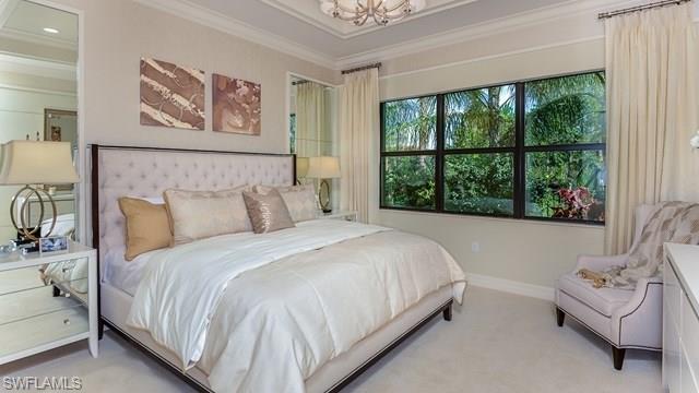 13338 Coronado Drive Naples, FL 34109 - Photo 4 of 19 a bedroom with a bed and a large window