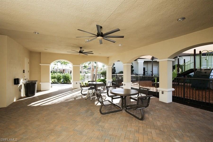 13338 Coronado Drive Naples, FL 34109 - Photo 8 of 19 a living room with furniture and a large window