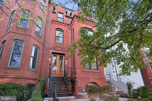 a front view of a house with stairs