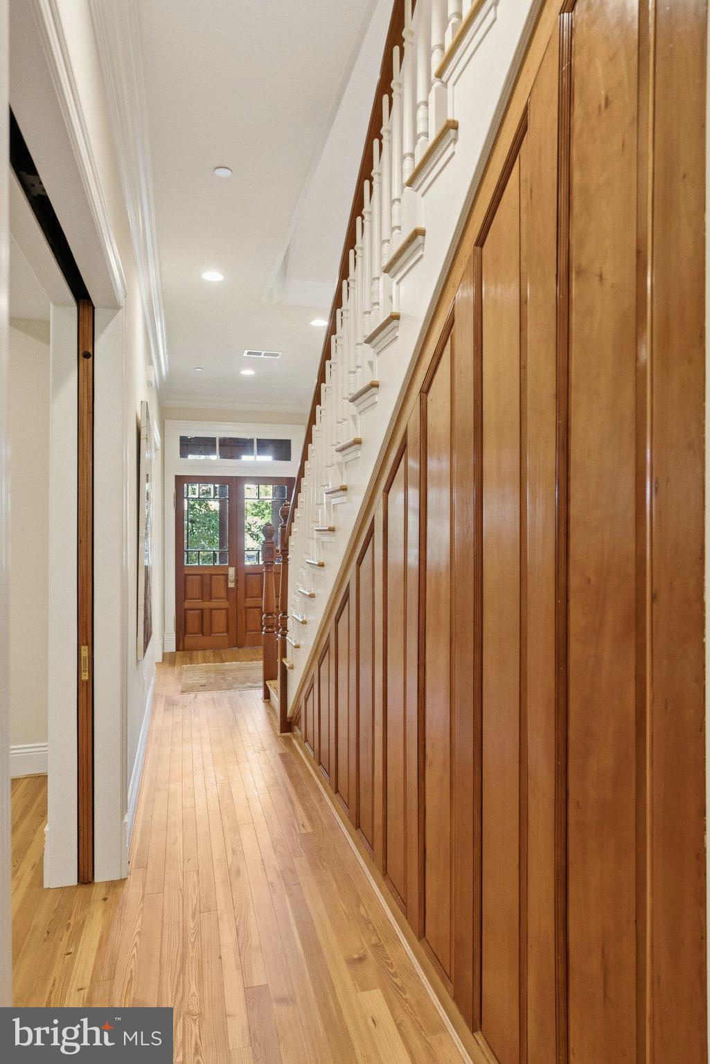1514 R Street Northwest Washington, DC 20009 - Photo 14 of 84 Elegant entryway with warm wood accents.