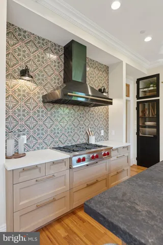 a spacious bedroom with a bed and a painting on the wall