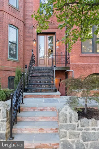 a view of a balcony with wooden floor and stairs