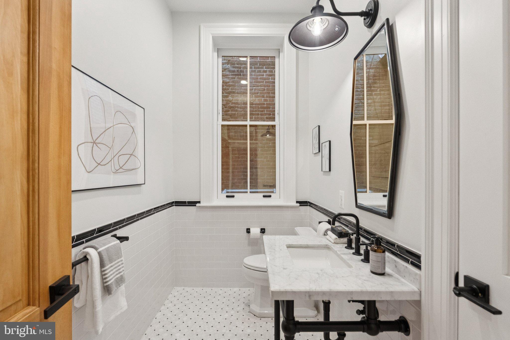 1514 R Street Northwest Washington, DC 20009 - Photo 27 of 84 a bathroom with a sink and a mirror