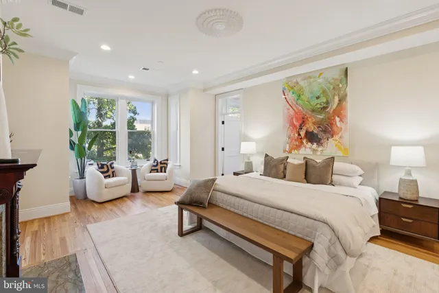 a view of a room with wooden floor and window