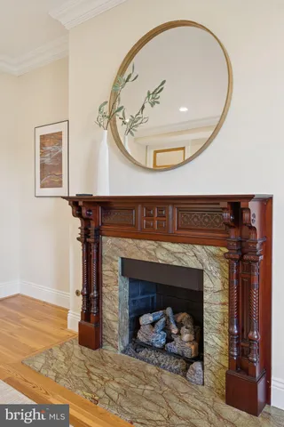 a bedroom with furniture and a large window