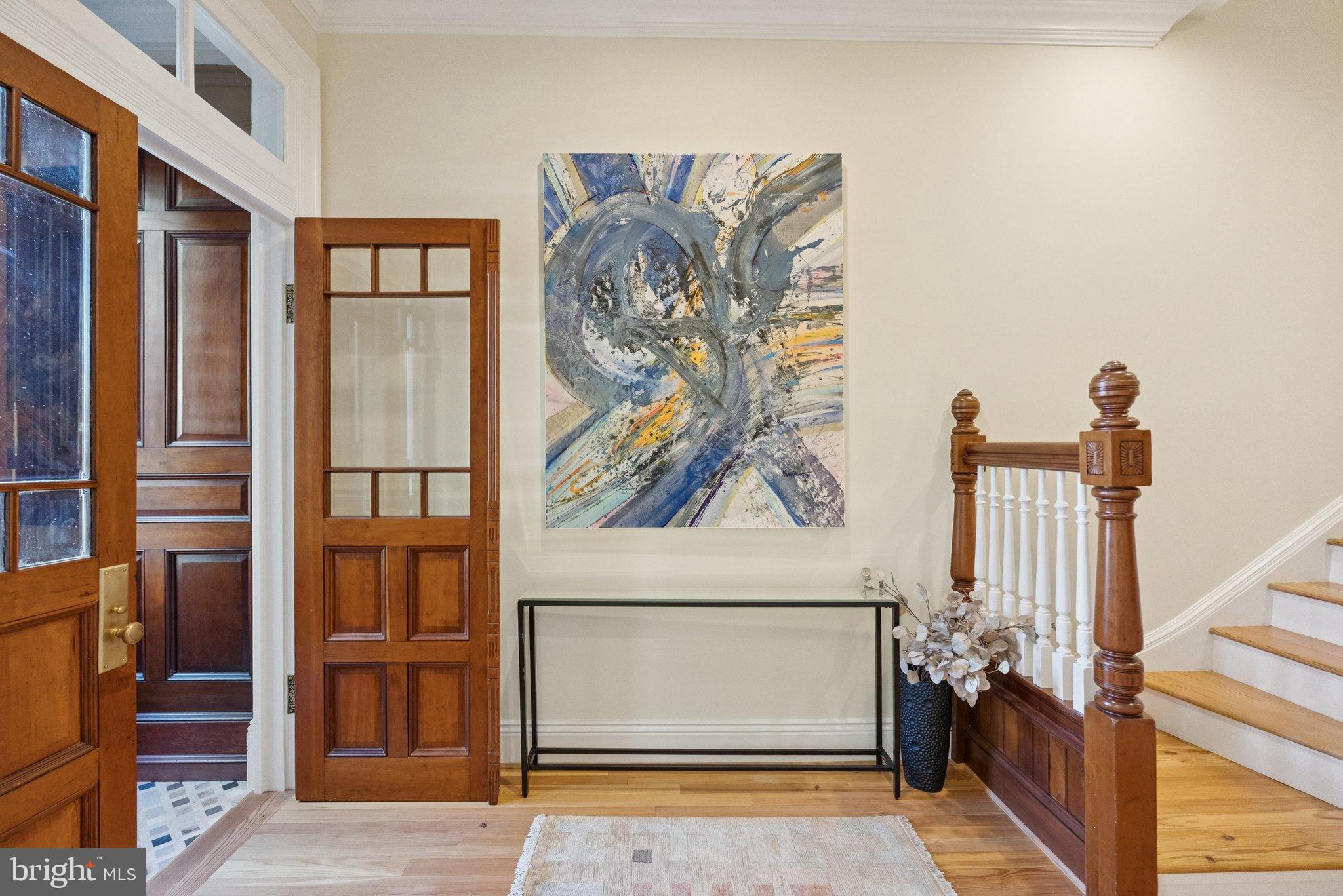 1514 R Street Northwest Washington, DC 20009 - Photo 4 of 84 Elegant entryway with vibrant artwork.