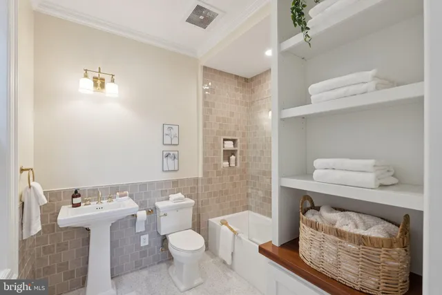 a view of a kitchen with a sink and a fireplace