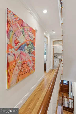 a bathroom with a sink mirror and toilet