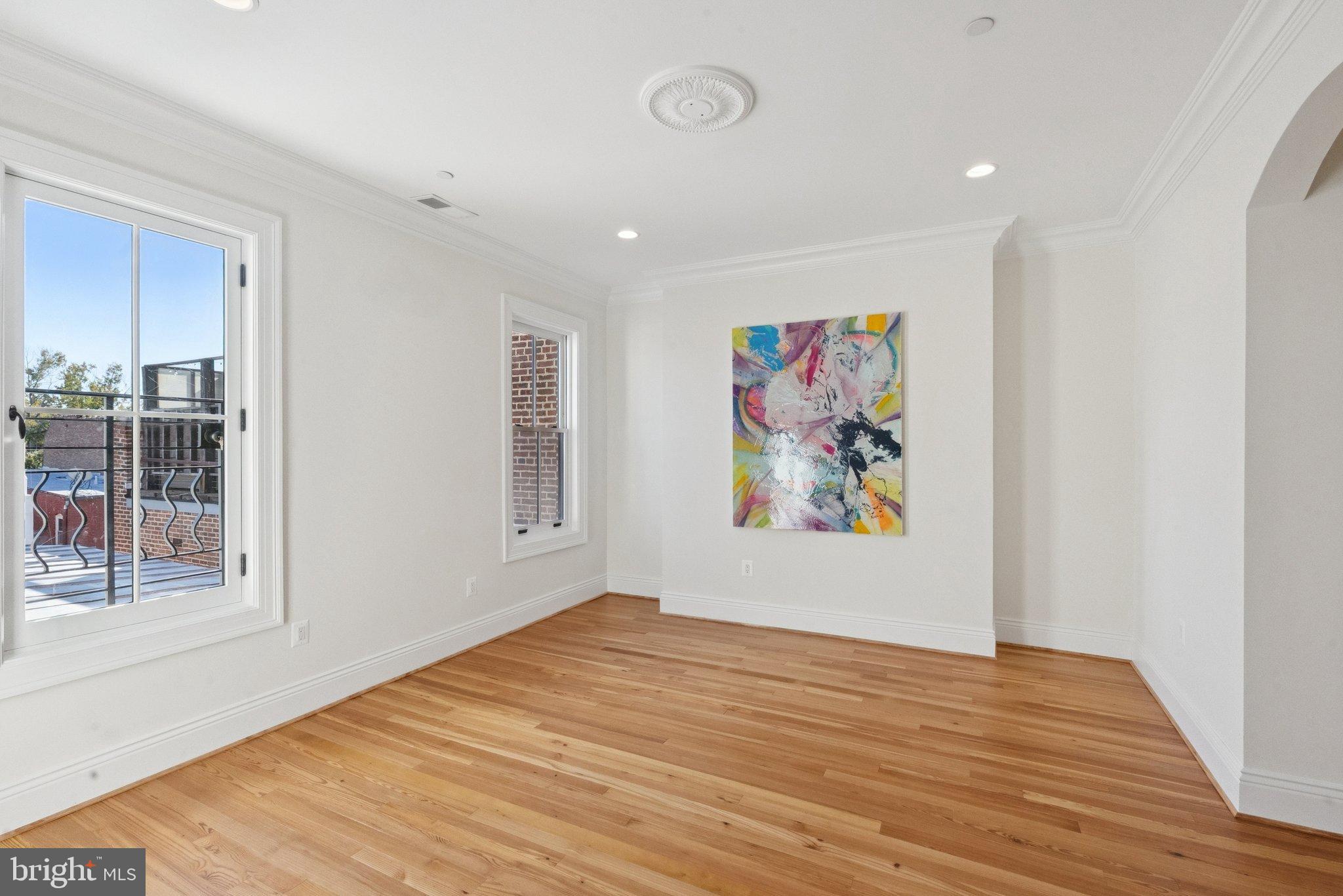 1514 R Street Northwest Washington, DC 20009 - Photo 46 of 84 a view of a room with wooden floor and window