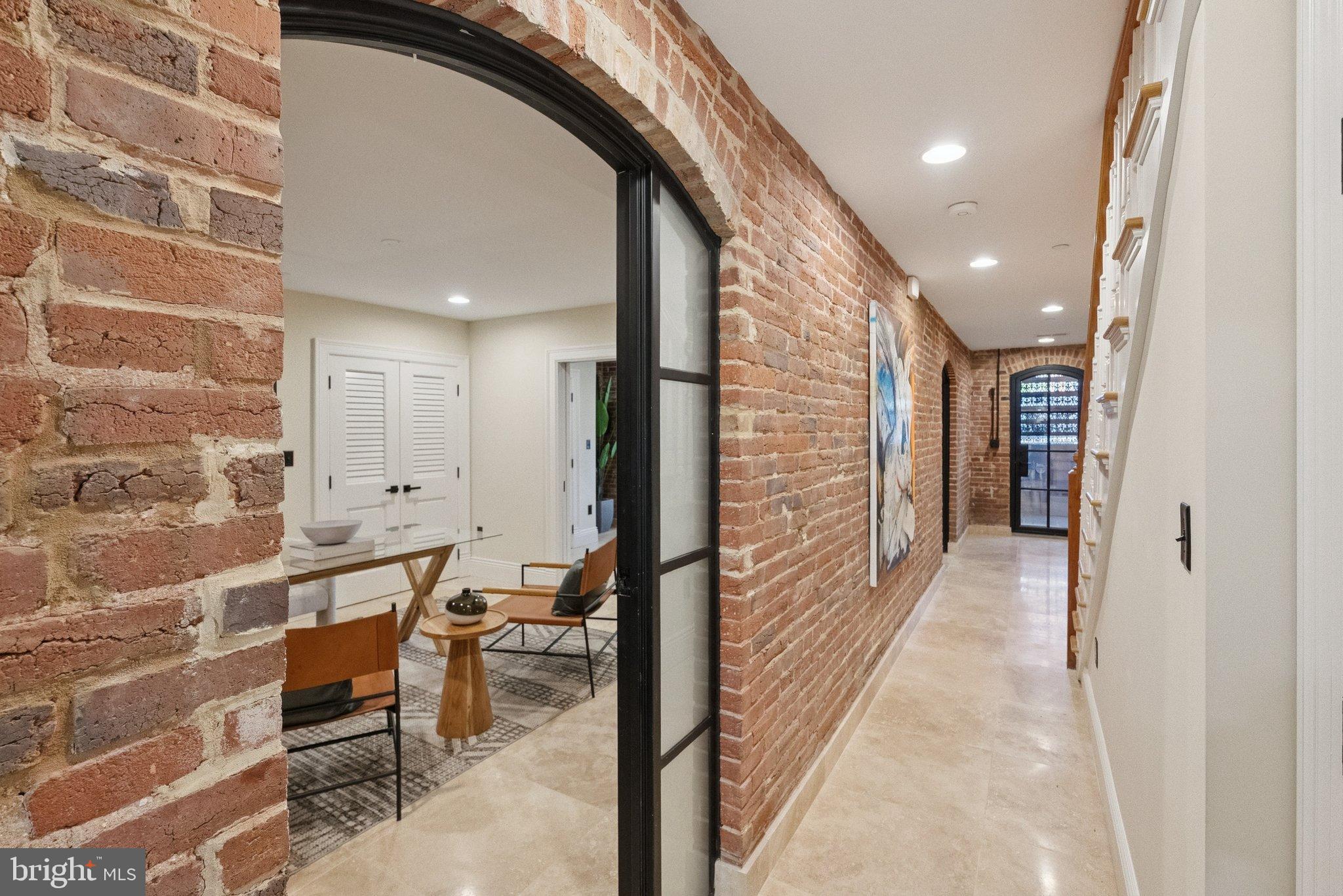 1514 R Street Northwest Washington, DC 20009 - Photo 58 of 84 Charming hallway with exposed brick elegance.