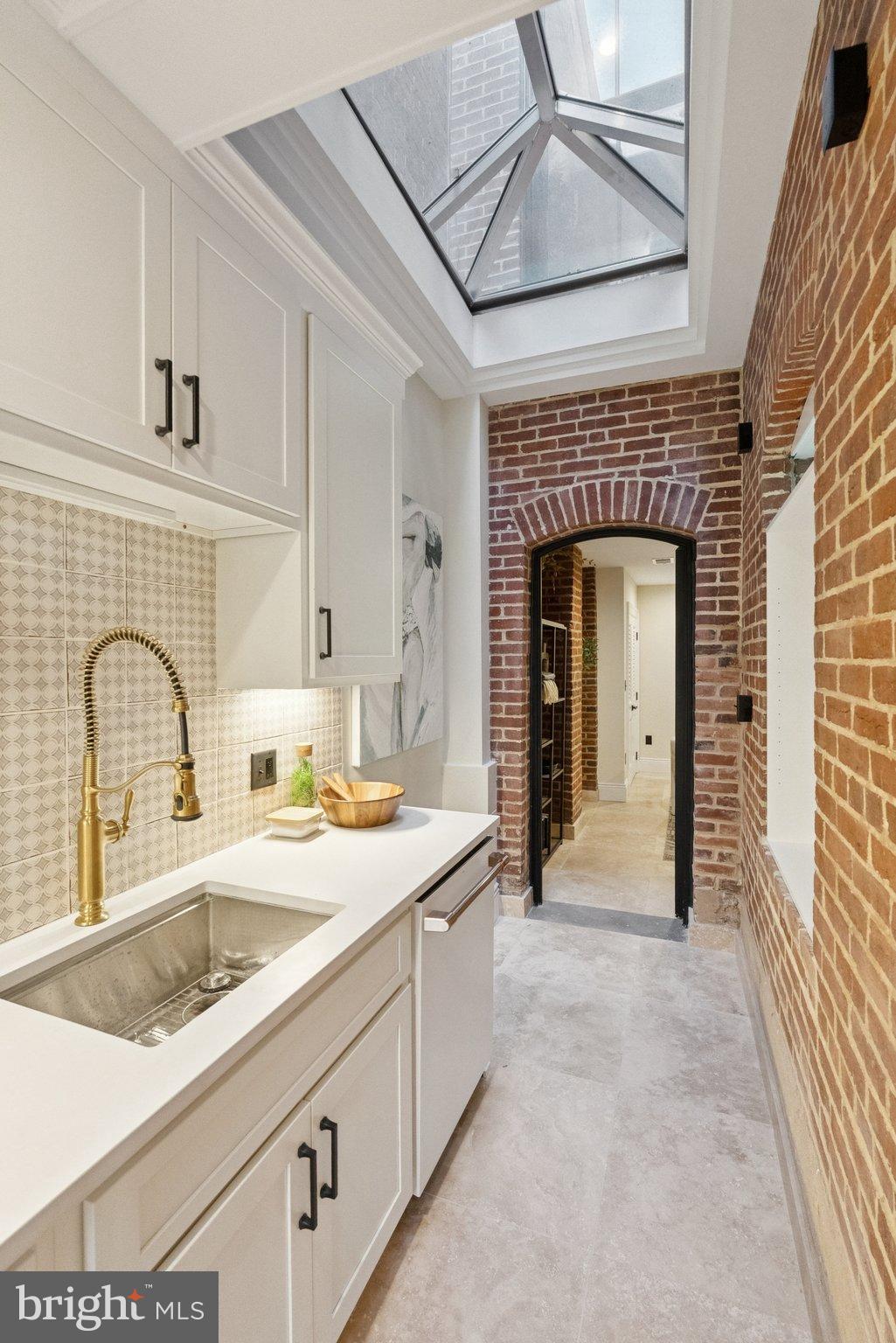 1514 R Street Northwest Washington, DC 20009 - Photo 68 of 84 a view of a kitchen with a sink and a fireplace