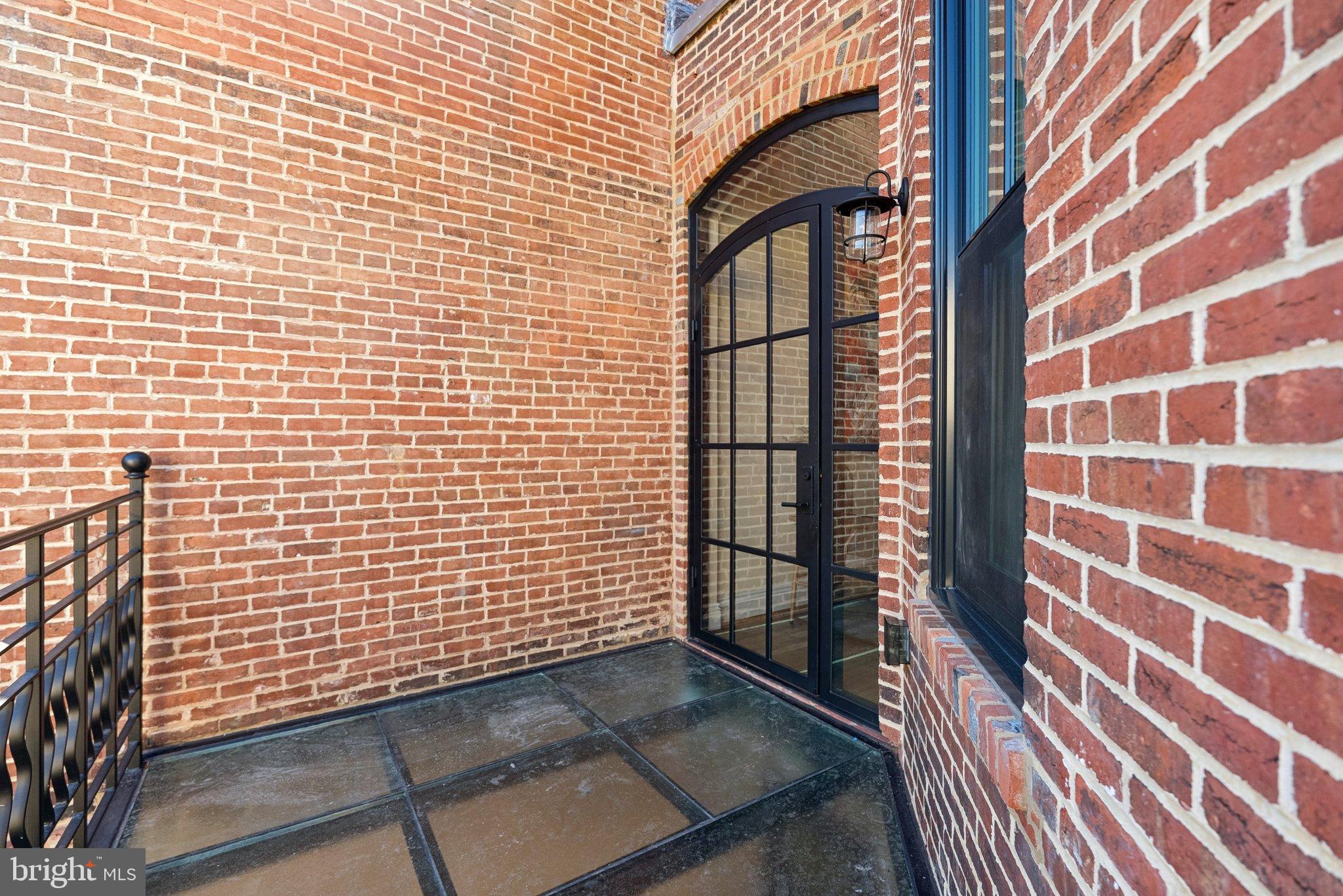 1514 R Street Northwest Washington, DC 20009 - Photo 75 of 84 Charming brick entryway with modern flair.