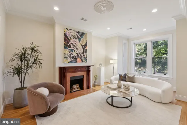 a view of a livingroom with furniture and a fireplace
