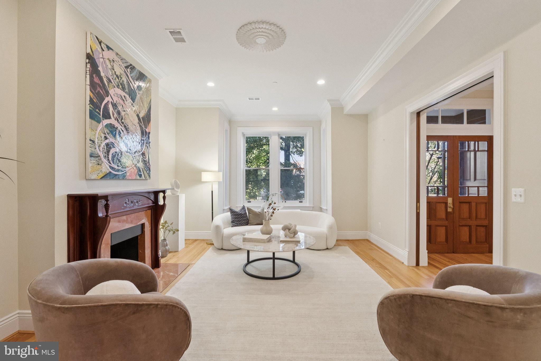 1514 R Street Northwest Washington, DC 20009 - Photo 9 of 84 a living room with furniture a fireplace and a large window