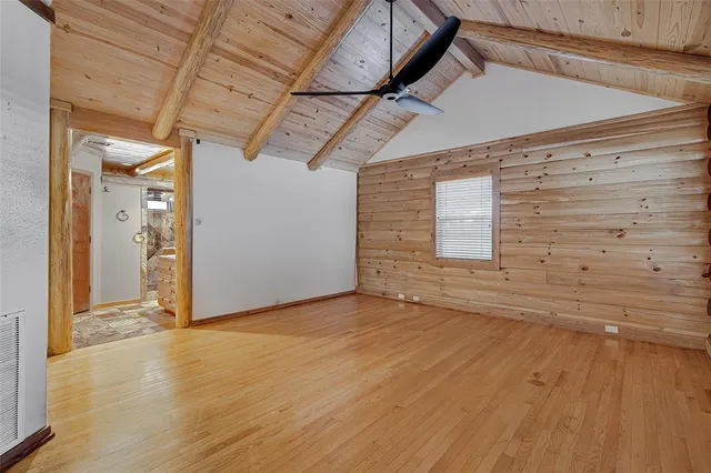 a kitchen with stainless steel appliances granite countertop a refrigerator a sink and a stove