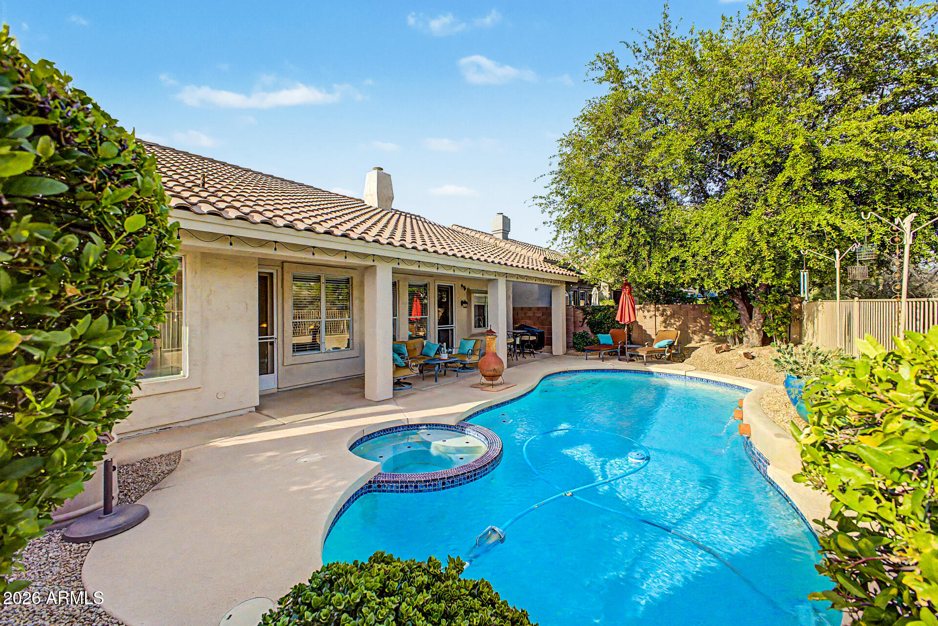 4309 East Rancho Caliente Drive Cave Creek, AZ 85331 - Photo 29 of 37 a view of a house with swimming pool and sitting area