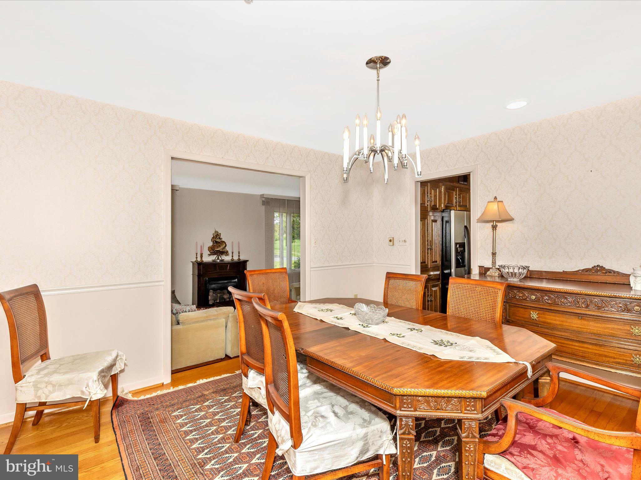 7903 Runnymeade Drive Frederick, MD 21702 - Photo 12 of 51 a view of a dining room with furniture and chandelier